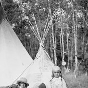 Cover image of Unknown children in front of tipi